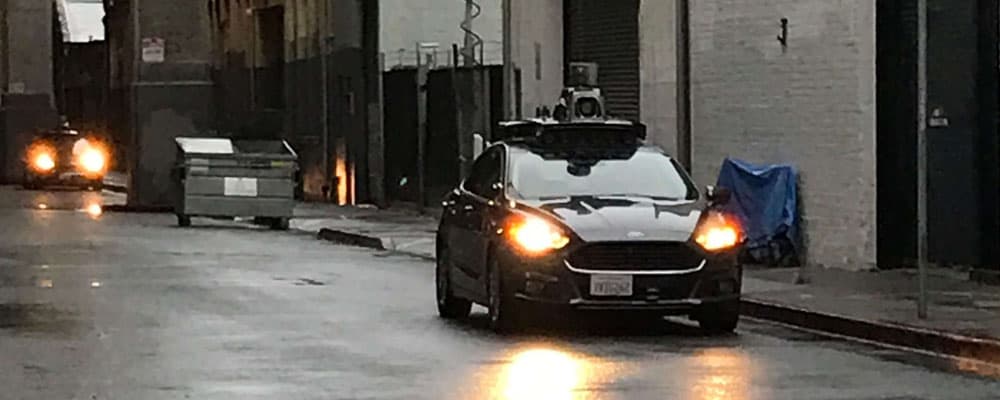 autonomous vehicle driving at dusk