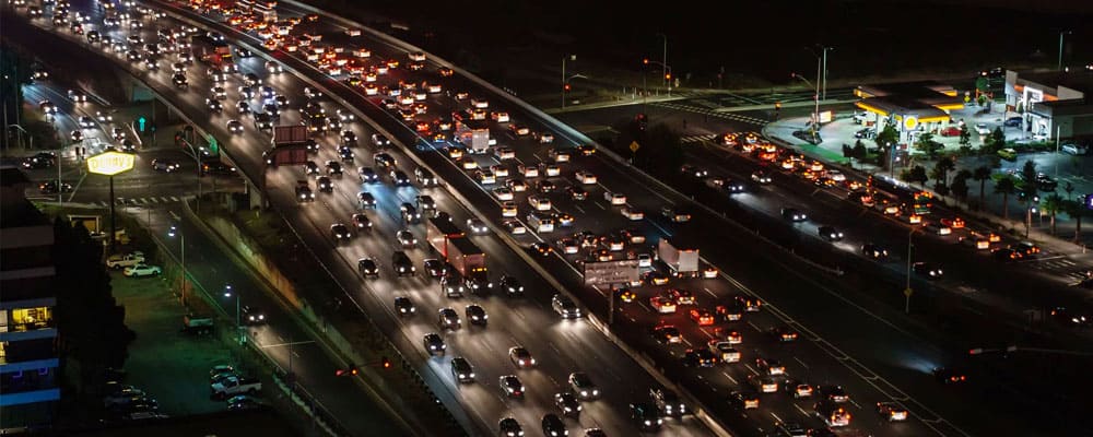 commuters on busy highway at night