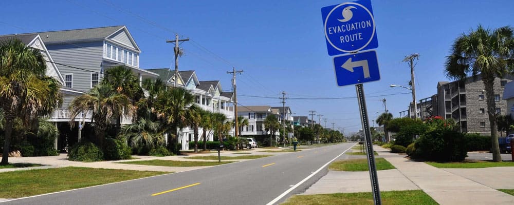 Coastal street with evacuation route sign