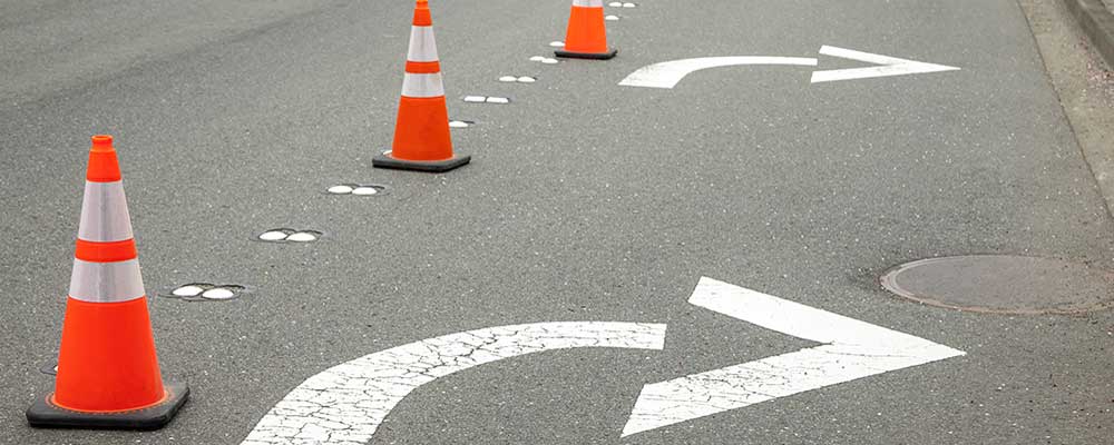 orange traffic cones on road for temporary traffic control