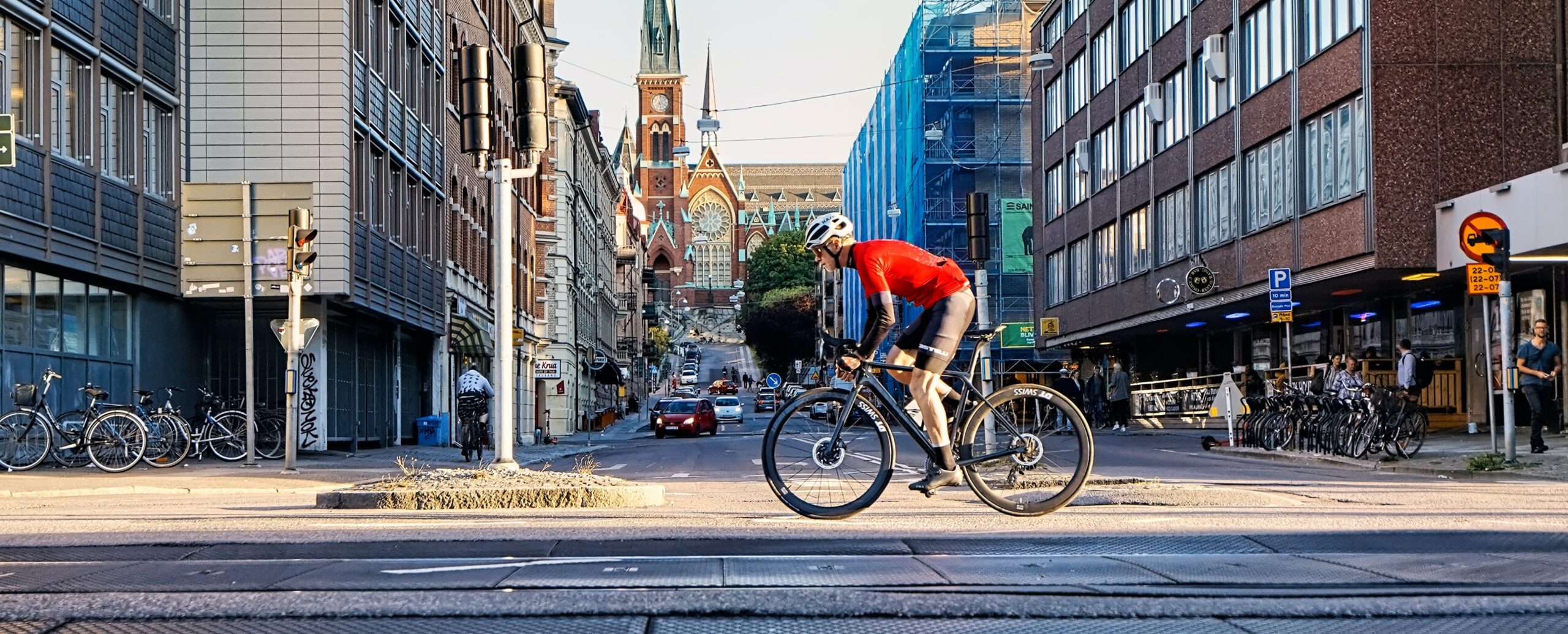 person biking on complete street