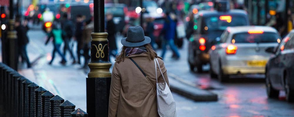 pedestrian walking on busy street